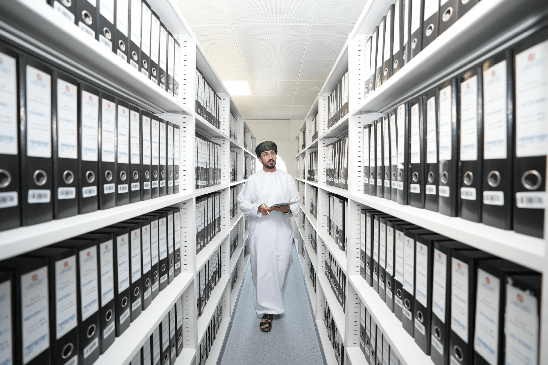 Man standing in archive Man standing in archive